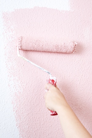 painting a wall in pinkの写真素材