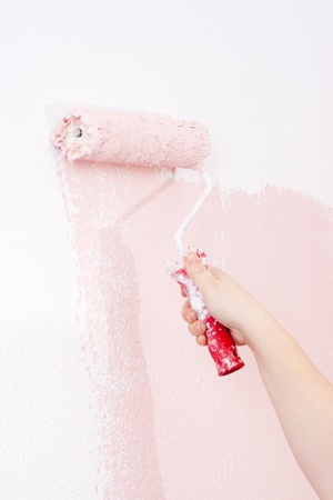 painting a wall in pinkの写真素材