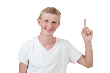 Portrait of a handsome young man pointing finger up against white backgroundの写真素材