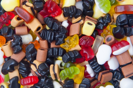 closeup of many colorful winegums isolatedの写真素材