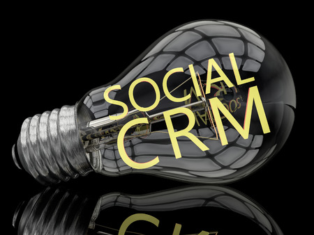 Social CRM - lightbulb on black background with text in it. 3d render illustration.の写真素材