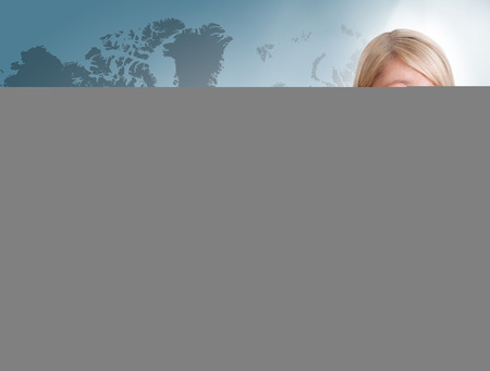 Young woman press digital Productivity button on interface in front of herの写真素材