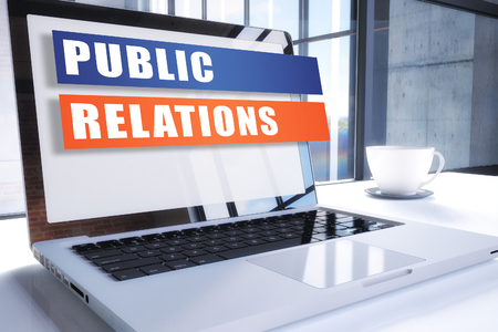 Public Relations text on modern laptop screen in office environment. 3D render illustration business text concept.の写真素材