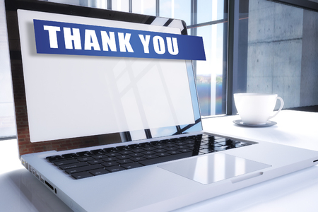 Thank you text on modern laptop screen in office environment. 3D render illustration business text concept.の写真素材
