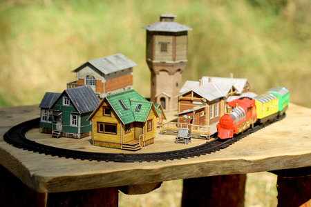 Miniature the old town with train, railway station, water tower and houses.の写真素材