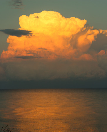 Storm cloud over the evening seaの写真素材