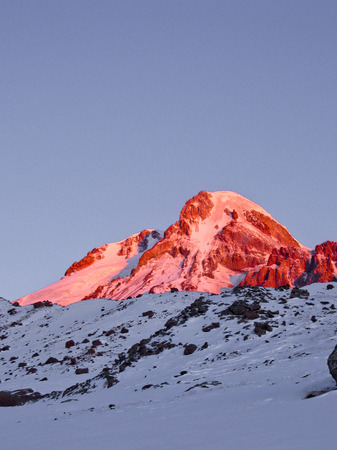Sunrise in  georgian mountains with view on the  Kazbek summitの写真素材