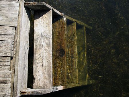 An Abandoned staircase on natural Latvian lake.の写真素材