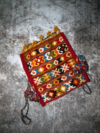 Image shows old bag hooked on the wallの写真素材