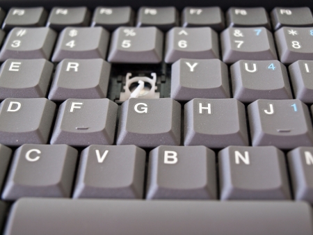 Image shows a broken button on grey keyboardの写真素材