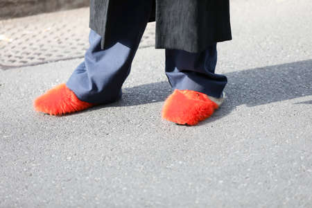 February 19, 2020: model wears a pair of orange slippers with fur during the Armani fashion show at the women`s fashion week fall / winter 2020, Milanのeditorial素材