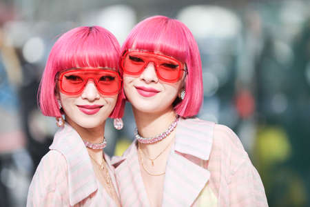 February 19, 2020: models with pink bob hair wear a pair of semitransparent red glasses during the Armani fashion show at the women's fashion weekのeditorial素材