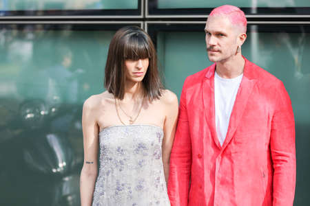 February 19, 2020: model wears an elegant dress with a bangs hairstyle, model a red jacket and red dyed hair during the Armani fashion show at the womのeditorial素材