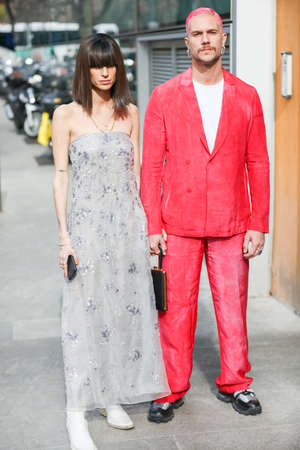 February 19, 2020: model wears an elegant dress with a bangs hairstyle, model a red jacket and red dyed hair during the Armani fashion show at the womのeditorial素材
