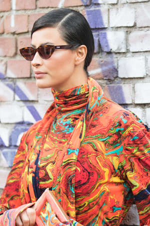 September 21, 2021: Model wears an orange colored dressのeditorial素材