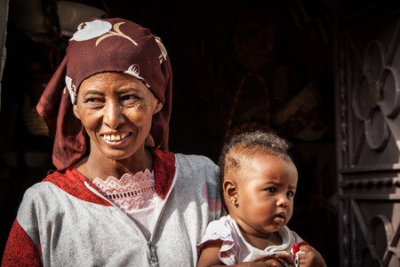 Woman with her child in  a Nubian village, Egyptのeditorial素材
