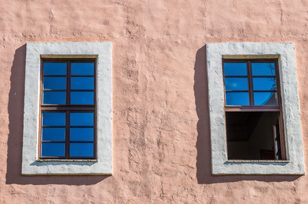 Twin windows in an ancient palace in Tuscany, Italyの写真素材