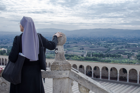 Assisi, Italy - October 2015 - Nun watch Assisi's panorama. Italy, 2015のeditorial素材
