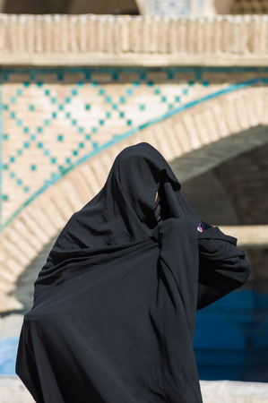 Esfahan, Iran - February 2016 - Muslim woman with traditional chador on the street. Iran, 2016のeditorial素材