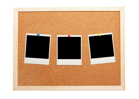Blank instant photos on a corkboardの写真素材