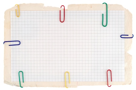 Checked notebook paper on the old grungy cardboard backgroundの写真素材