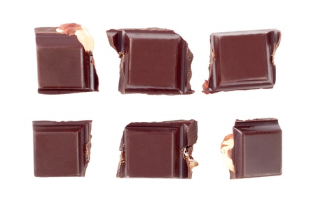 Pieces on nuts chocolate isolated on white backgroundの写真素材