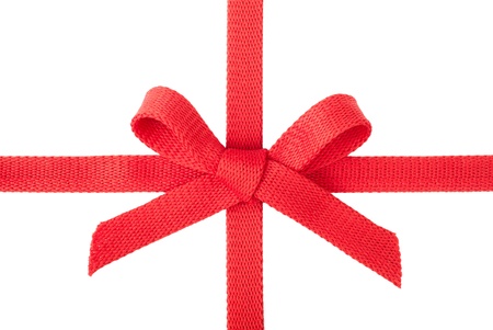 Red ribbon with a bow isolated on white backgroundの写真素材