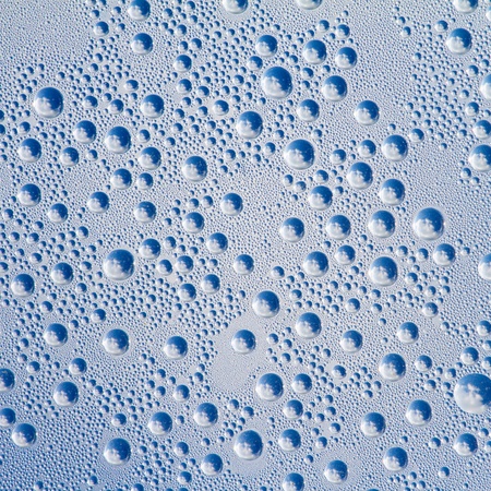 Water drops on a grey-blue backgroundの写真素材