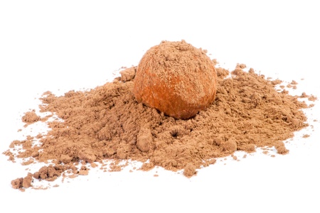 Chocolate truffle candy in cocoa powder isolated on whiteの写真素材