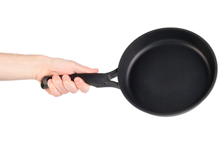 Frying pan in a hand isolated on white backgroundの写真素材