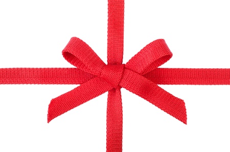 Red gift ribbon with a bow isolated on whiteの写真素材