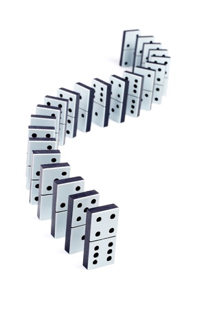 Domino pieces in a line on white backgroundの写真素材