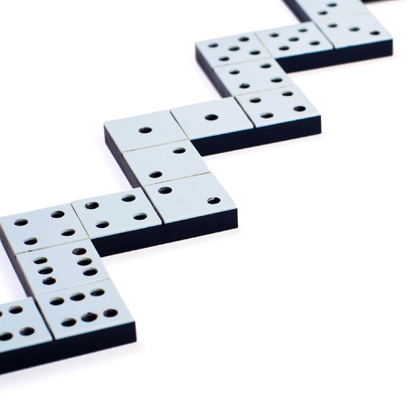 Domino pieces in a line or zigzag on white backgroundの写真素材