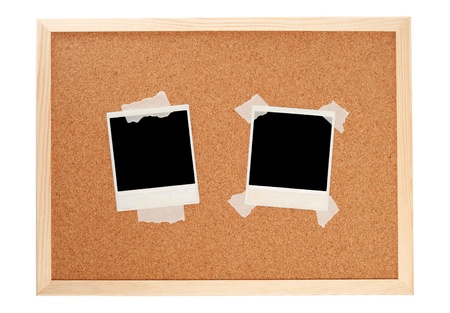 Black instant photos on a cork boardの写真素材