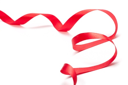 Red ribbon on white backgroundの写真素材