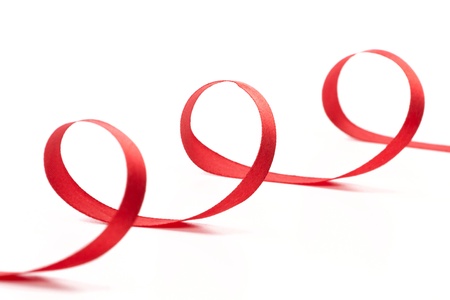 Red Christmas ribbon on white backgroundの写真素材