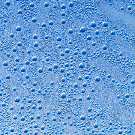 Water drops on a grey-blue backgroundの写真素材