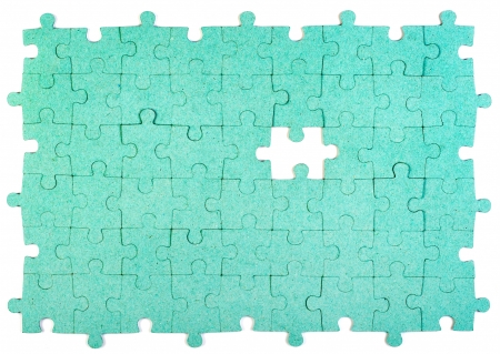 Green puzzle with missing pieceの写真素材