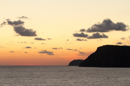 Beautiful mountain seaside at sunsetの写真素材