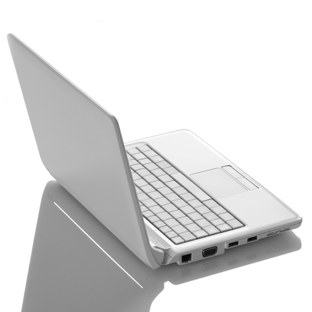 White open laptop with black screen on white backgroundの写真素材