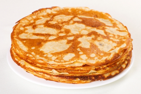 Stack of pancakes isolated on white backgroundの写真素材