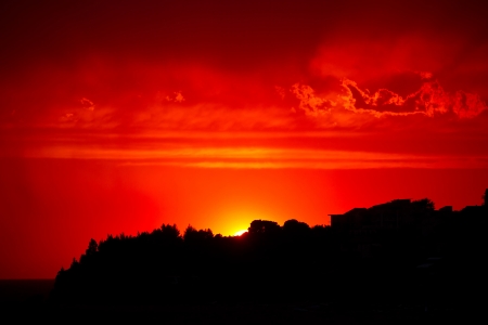 Red sunset sky with dramatic cloudsの写真素材
