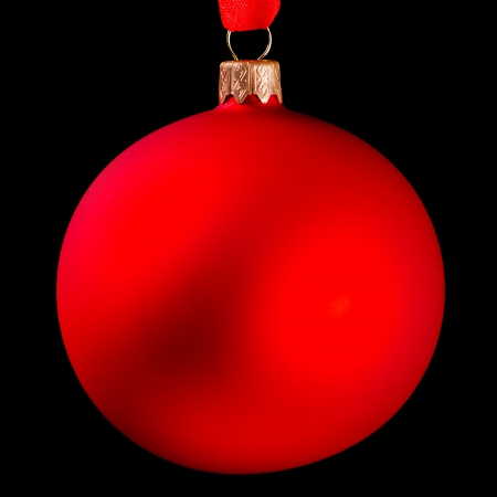 Red Christmas ball isolated on black backgroundの写真素材