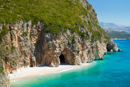 Beautiful sunny beach with white sand and blue waterの写真素材