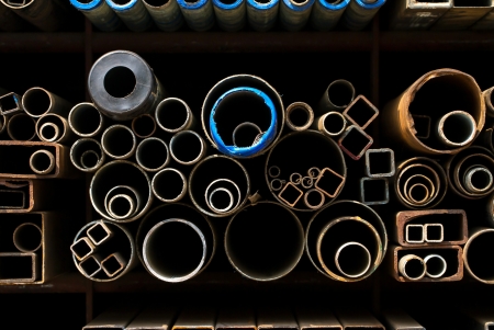 Stacked steel pipes and tubes backgroundの写真素材