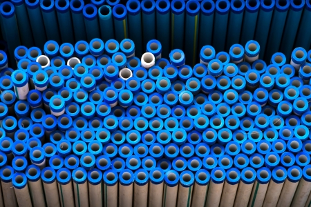 Stacked plastic pipes and tubes backgroundの写真素材