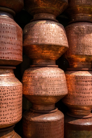 Copper cooking pots at the market in Indiaの写真素材