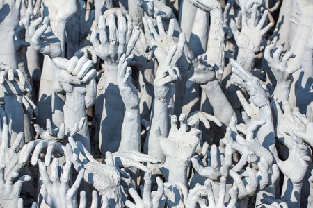Sculptures of famous Wat Rong Khun (White temple) in Chiang Rai province, Northern Thailand