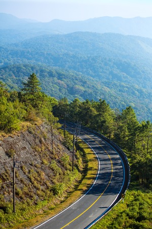 Mountain road and a scenic mountain viewの写真素材