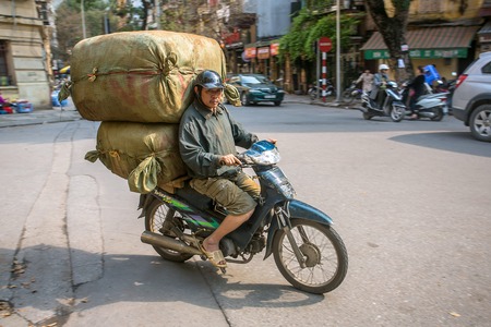 HANOI, VIETNAM - APRIL 2014: Overloaded motorbike on the streets of Hanoi, on April 7, 2014 .のeditorial素材